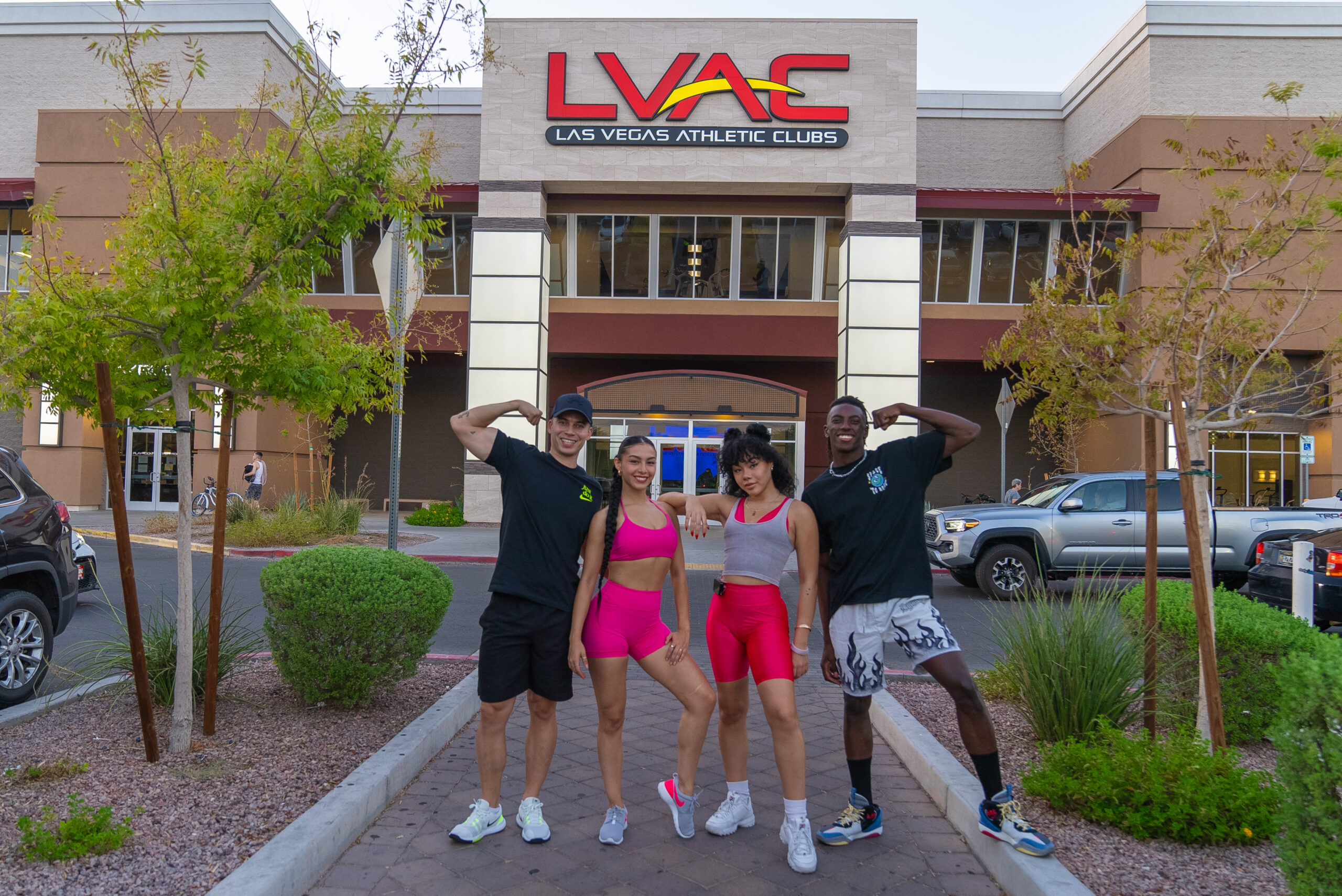 A friend group posing in front of LVAC