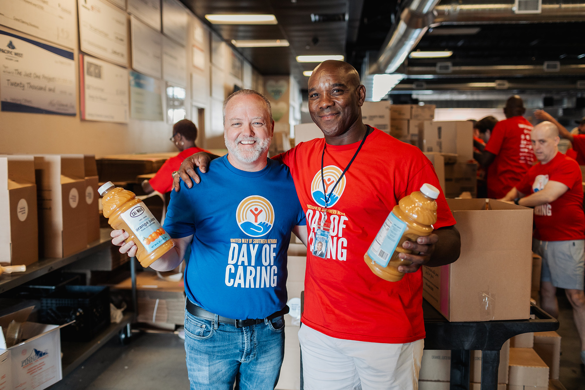 Two male volunteers show off donations made to United Way to support the local Las Vegas community.