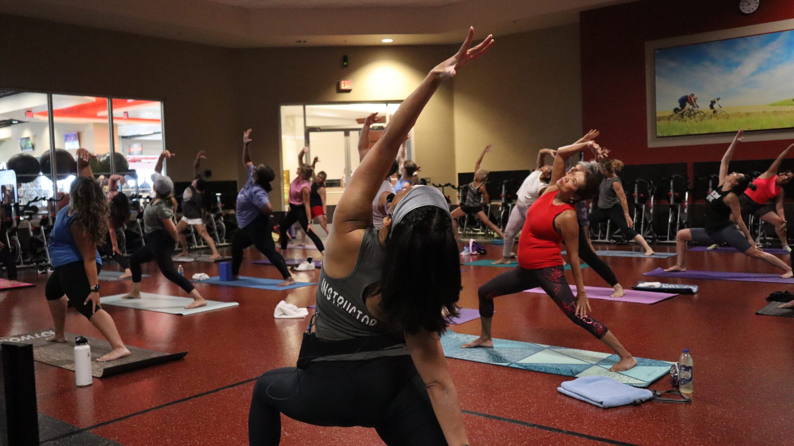 Relaxed members at LVAC follow the movements of a BodyFlow instructor.